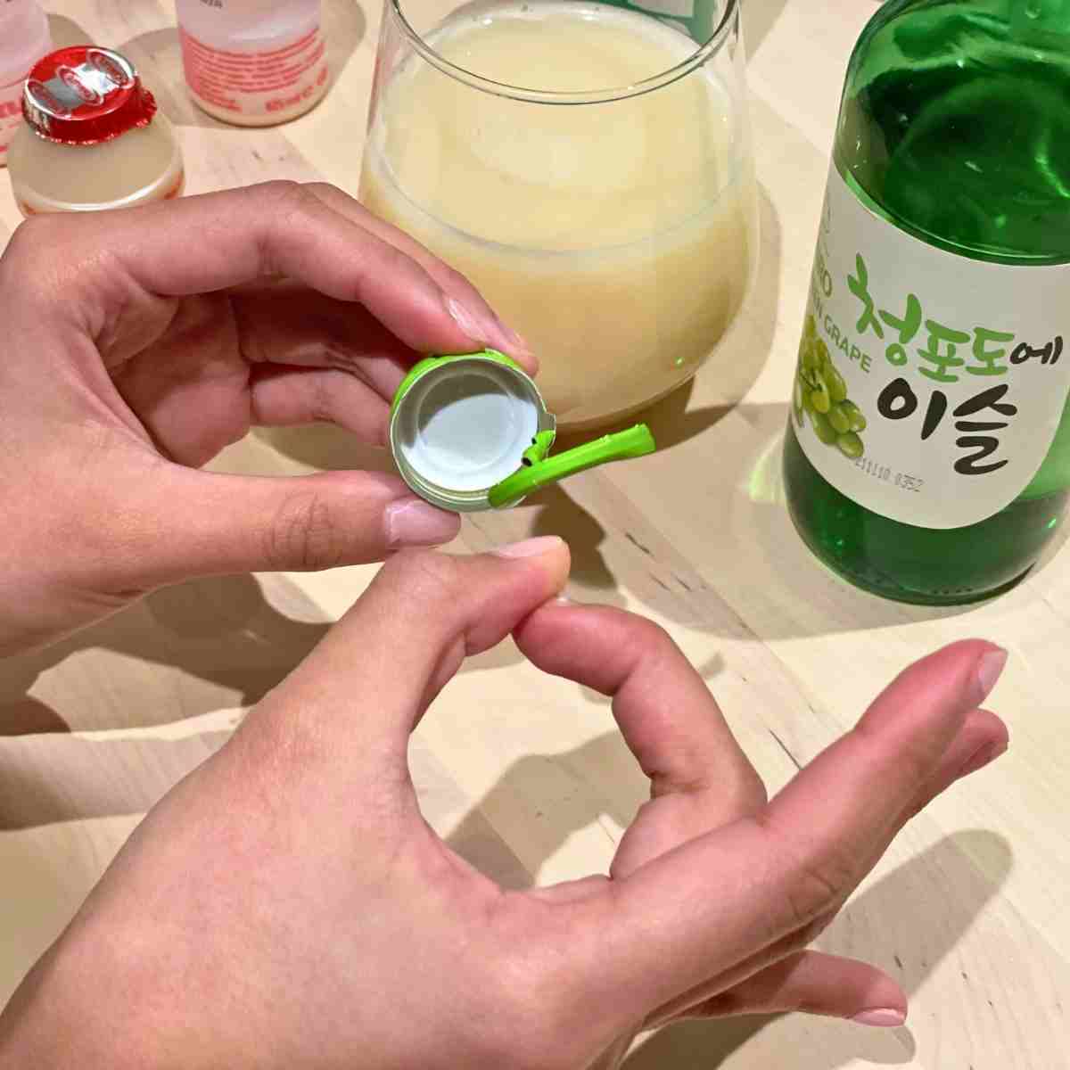 flick soju cap drinking game