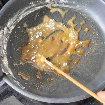 heat sugar in pan and stir with chopstick