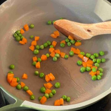 stir fry carrots pea in hot oil