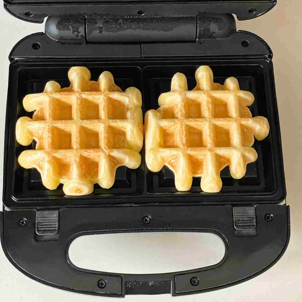 Waffle maker with waffles on it