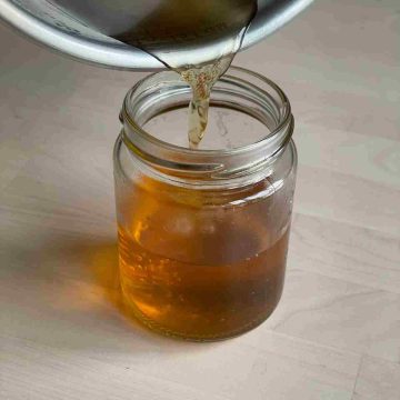 pour sugar free vanilla syrup into jar
